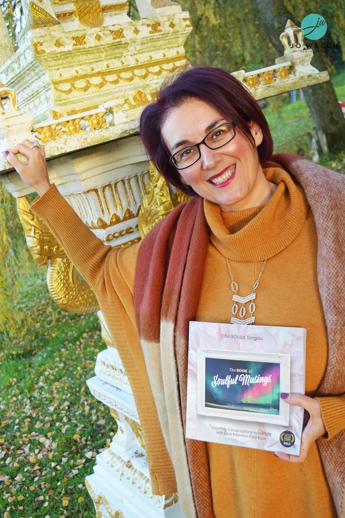 ChriSOULa standing and smiling with book